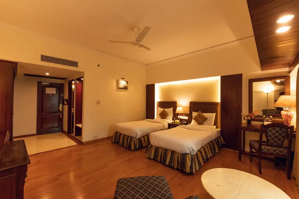 A room with twin bed at A Hotel Ludhiana