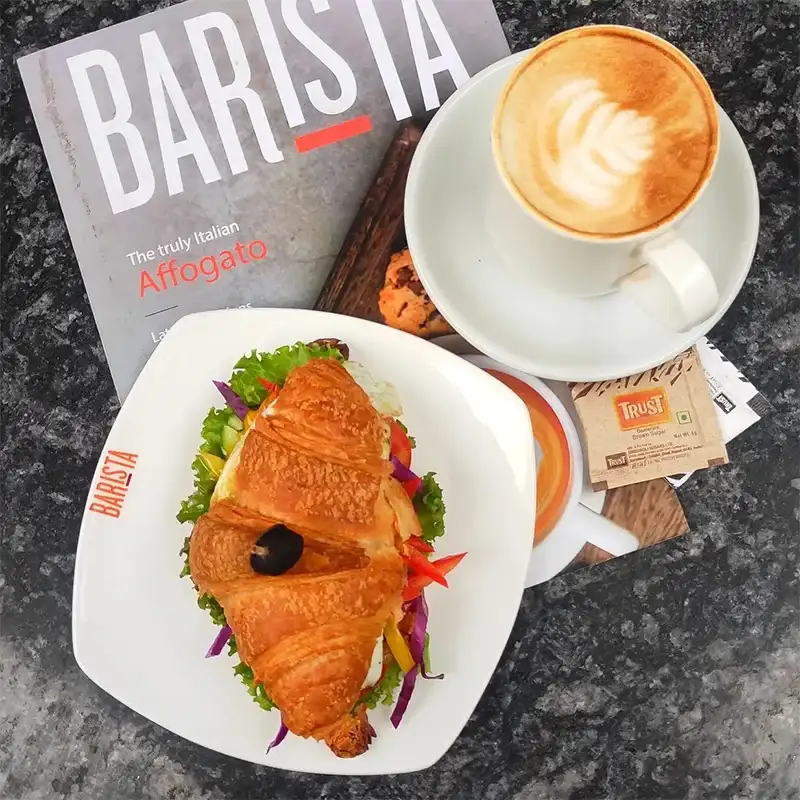 An image from A hotel's instagram account showcasing the delicious croissant and a cup of coffee